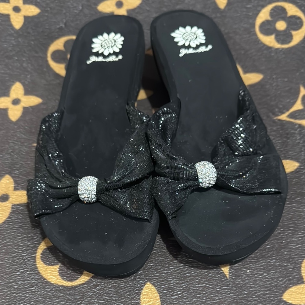 Yellow Box Black Sandals with rhinestone Embellishments and a bow detail.